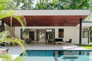 Modern private home in Dominical with infinity pool and outdoor seating.