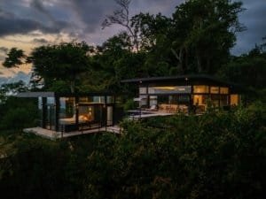 Modern Costa Rica home with panoramic ocean views and lush surroundings.