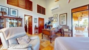 Bright living room with tropical decor and outdoor view in Dominical.