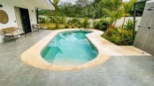 Relaxing private pool with lush tropical garden in Costa Rica.