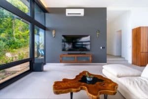 Contemporary living room with large windows and ocean view in Dominical.