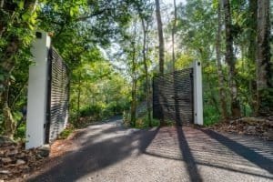 Gated entrance to a lush forest property in Dominical, Costa Rica.