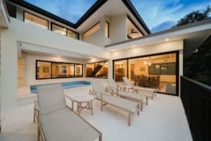 Modern Costa Rican estate with pool, outdoor lounge, and jungle views.