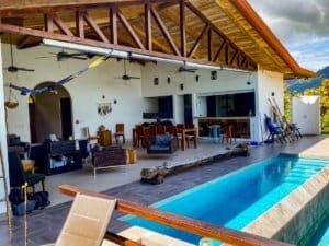 Modern Costa Rica villa with pool, outdoor lounge, and ocean view.