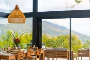 Dining area with mountain view and large glass windows in Costa Rica.