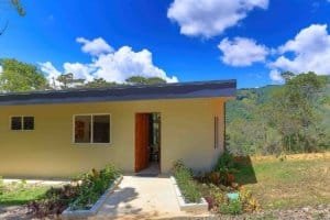 Small modern house with garden and mountain view in Dominical, Costa Rica.