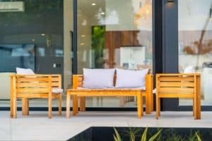 Modern outdoor seating area with wooden benches and cushions in Costa Rica.