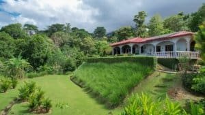 Beautiful tropical villa with lush garden and mountain view in Costa Rica.