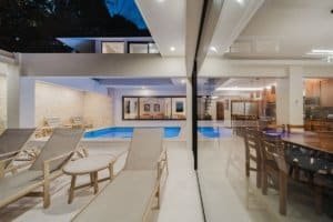 Modern interior with pool and outdoor lounge area in Costa Rica.