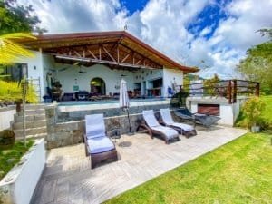 Luxury home with pool, ocean view, and outdoor lounge in Dominical.