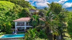 Tropical home with pool and lush greenery in Dominical, Costa Rica.