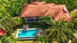 Aerial view of a home and boutique lodge with ocean view in Dominical, Costa Rica.