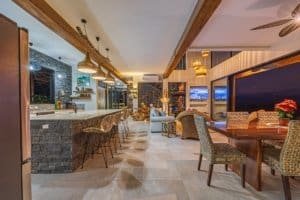 Interior of a luxury Costa Rica estate with mountain views, pool, and modern decor.