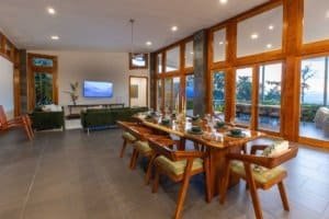Spacious dining room with panoramic mountain views and modern decor.
