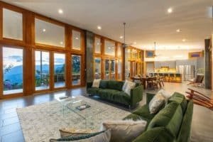 Spacious living room with panoramic mountain views and modern decor.