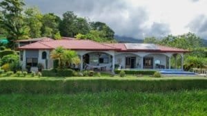 Beautiful tropical hacienda with white water ocean view in gated community.