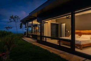 Modern Costa Rican home with panoramic ocean view and interior bedroom.