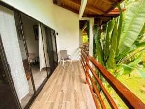 Balcony with ocean view and lush tropical greenery in Dominical.