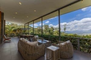 Spacious balcony with mountain view and lush greenery in Costa Rica.