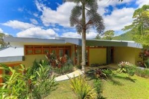 Modern mountain home with lush garden and panoramic views in Dominical.
