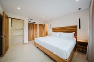 Modern bedroom with wooden furniture and bright decor in Costa Rica.