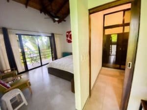 Bedroom with balcony and tropical view in Dominical Costa Rica.