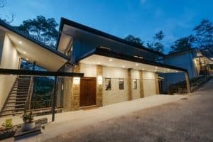 Modern luxury estate in Dominical with rainforest and mountain views.
