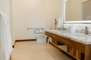 Modern bathroom with marble sink and rainforest view near Dominical.