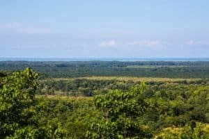 Panoramic view of lush green mountains and ocean in Dominical, Costa Rica.