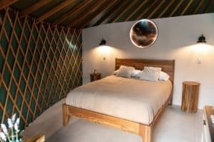 Modern bedroom with wooden accents and celestial decor in Dominical.