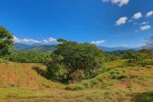 Beautiful Costa Rican landscape with rolling hills and lush greenery.