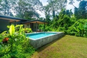 Japanese style home with pool surrounded by lush jungle greenery in Dominical.