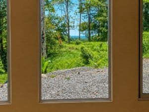View from a jungle home in Dominical overlooking trees and a creek.