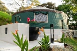 Luxury glamping tent with outdoor shower and garden in Dominical, Costa Rica.