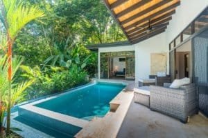 Modern Costa Rican home with private pool and lush garden view.