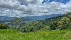 Lush green mountains and cloudy sky in Dominical, Costa Rica.