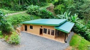 Charming single-story house surrounded by lush tropical forest in Dominical, Costa Rica.