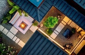 Aerial view of a luxury Costa Rican home with lush garden and modern design elements.