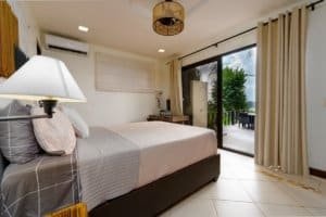 Bedroom with balcony and ocean view in Dominical Costa Rica.