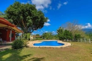 Beautiful pool with lush garden and mountain view in Dominical Costa Rica.