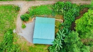 Aerial view of a jungle home with lush greenery in Dominical, Costa Rica.