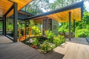 Contemporary house with wooden accents surrounded by lush greenery in Dominical.