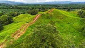 Serene jungle landscape with trails and mountain backdrop in Dominical, Costa Rica.
