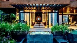 Modern luxury home in Dominical with stunning whale's tail view and lush surroundings.