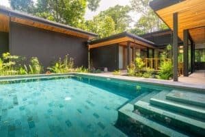 Modern Japanese style home with pool surrounded by lush jungle in Dominical.