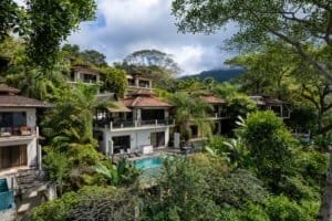 Ocean view villas with pools and lush greenery in Dominical.