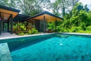 Japanese style home with pool surrounded by lush jungle in Dominical, Costa Rica.