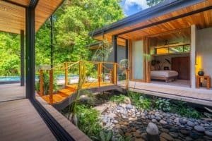 Japanese style home with pool, surrounded by lush jungle greenery in Costa Rica.