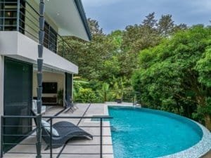 Modern rainforest home with pool and lush greenery in Dominical.