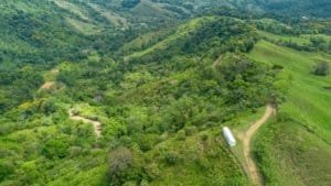 Lush green hills and forested landscape in Dominical, Costa Rica.